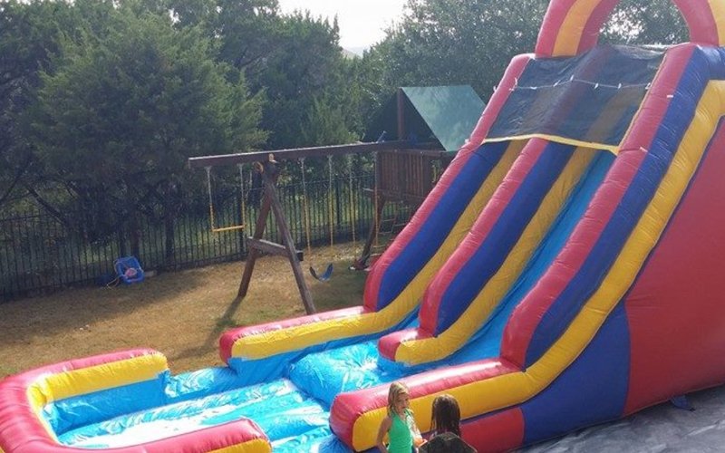 Kids on dual lane water slide rental Hutto TX